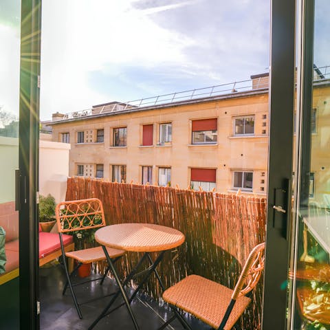 Soak up the Parisian sun on the balcony