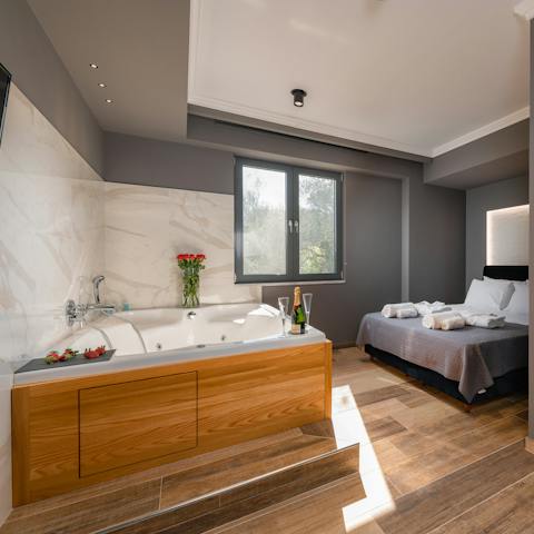 Grab a drink and hot tub in the master bedroom, letting your worries melt away
