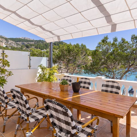 Share memorable Mediterranean meals alfresco, shaded from the midday sun