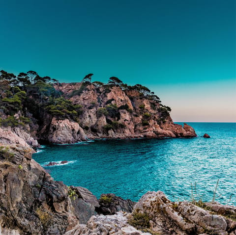 Explore the breathtaking coastline of Marbella, boasting dramatic cliffs and deep teal sea