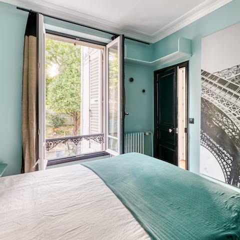 Take in the views over the pretty garden from the main bedroom's Juliet balcony