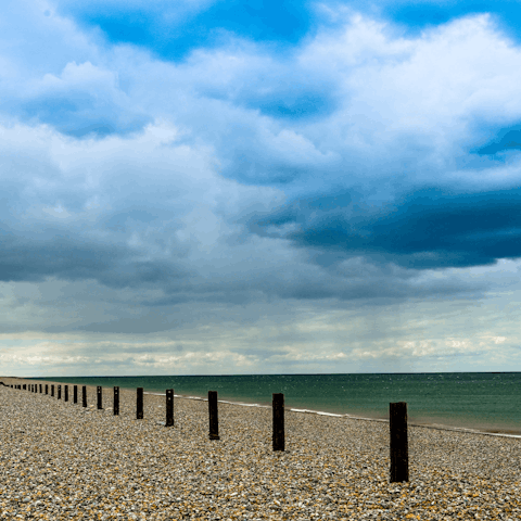 Drive eleven minutes to take a walk along Salthouse Beach