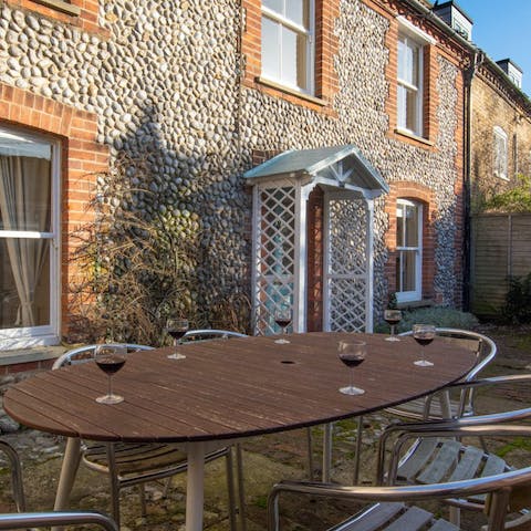 Pour the wine to accompany alfresco nibbles out front