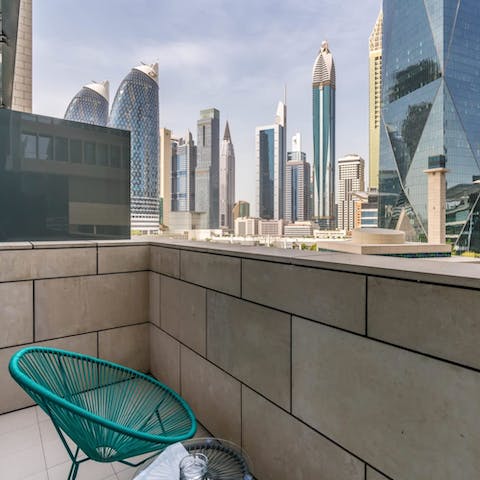 Look out over the DIFC from the private balcony with your morning coffee