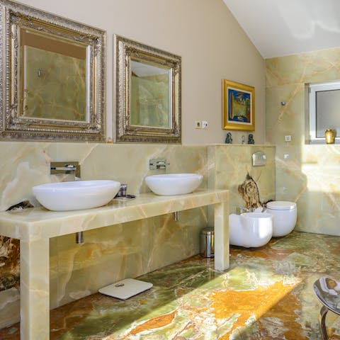 Get dolled up in the opulent marble bathrooms