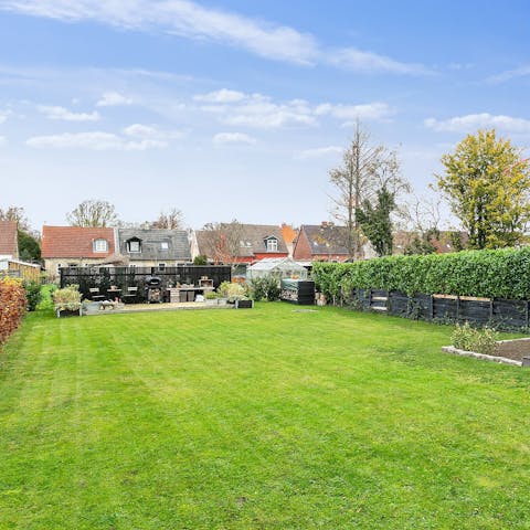 Spend sunny afternoons unwinding in the lush back garden