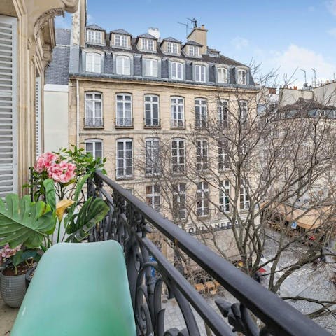 Take in the views over pretty Place du Bourg Tibourg from the balcony