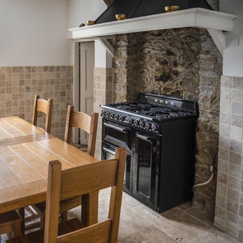 Cook up a feast of rustic French specialties in this traditional kitchen complete with tactile exposed stone