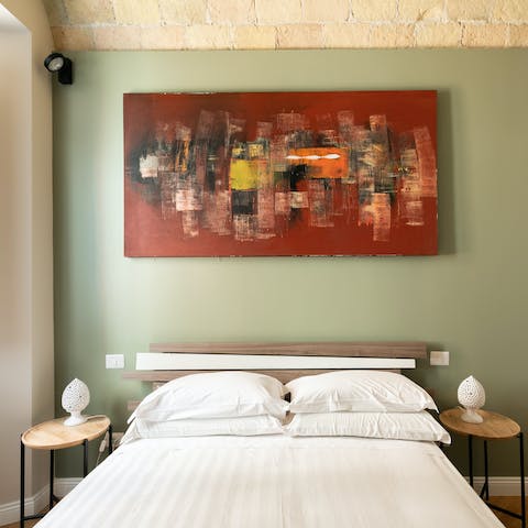 Wake up feeling ready to explore Rome in the sleek bedrooms