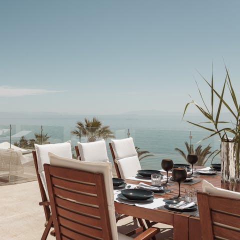 Share a bottle of wine while admiring the coastal views