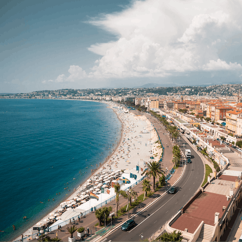 Explore Nice's sun-soaked beaches, a short drive away