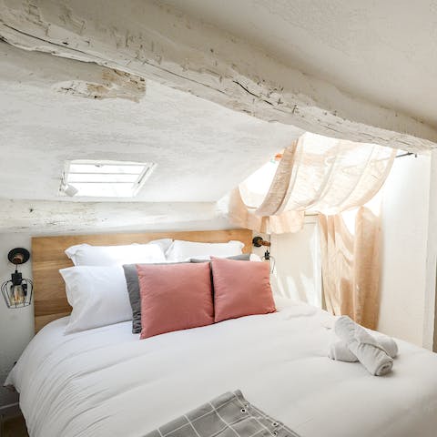 Look forward to dozing off beneath the rustic timber beams