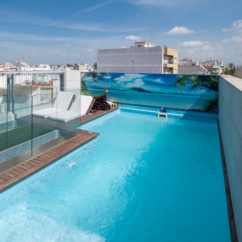 Enjoy the height of rejuvenation from the rooftop pool