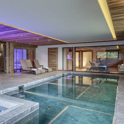 Swim laps in the heated pool in the wellness area 