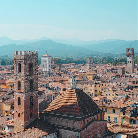 Stroll through the old town of Lucca, encircled with its mediaeval city walls