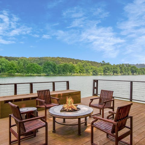 Enjoy the stunning waterfront position of this deck as you gather around the fire pit