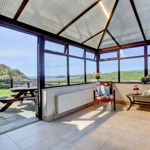 Escape the rain without giving up the view in this stunning conservatory