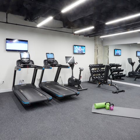 Start your day with a workout in the building's shared fitness room