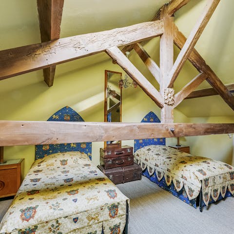 Bedrooms adorned with chunky wooden beams