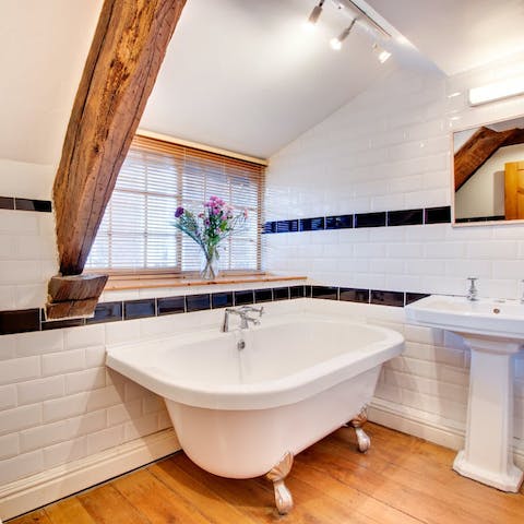 Enjoy a relaxing soak in the clawfoot bath after a busy day of exploring