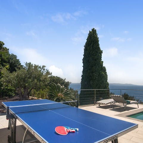 Challenge your loved ones to a game of table tennis in the sunshine