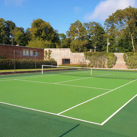 Head to the estate's tennis court for a game in the sunshine