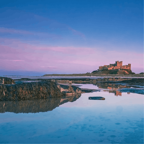 Pay a visit to the impressive coastal castle at Bamburgh, just a few miles away