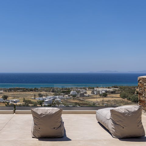 Bag one of the beanbag loungers and gaze out at the Aegean view