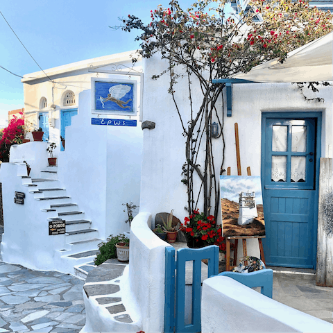 Wander through the pretty blue and white towns of Tinos