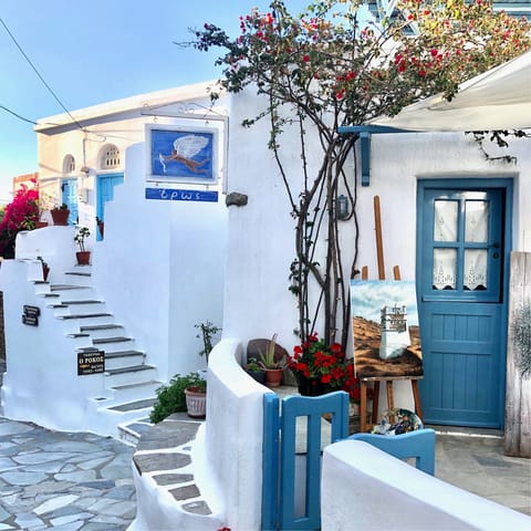 Wander through the pretty blue and white towns of Tinos