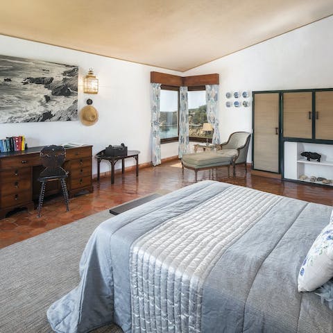 Wake up in a lavishly decorated bedroom, with ornate wooden furnishings