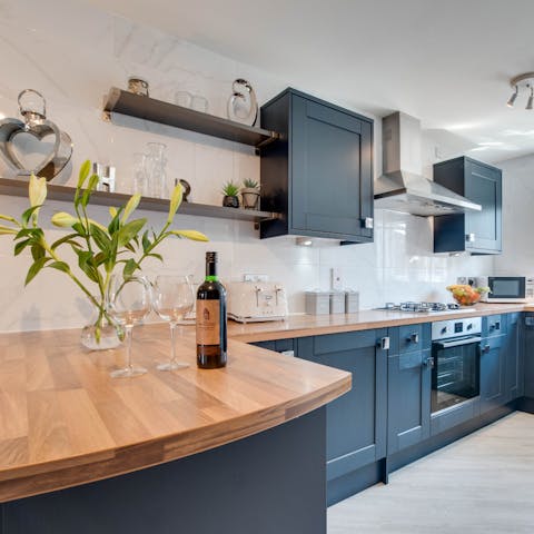 Enjoy plenty of prep space in the midnight-blue kitchen