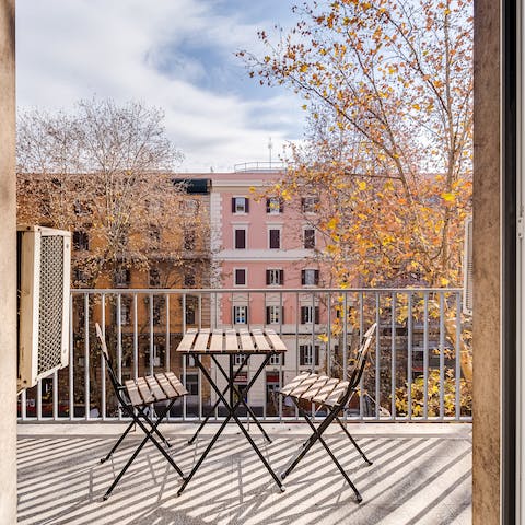 Catch the sun on the balcony overlooking your lively street