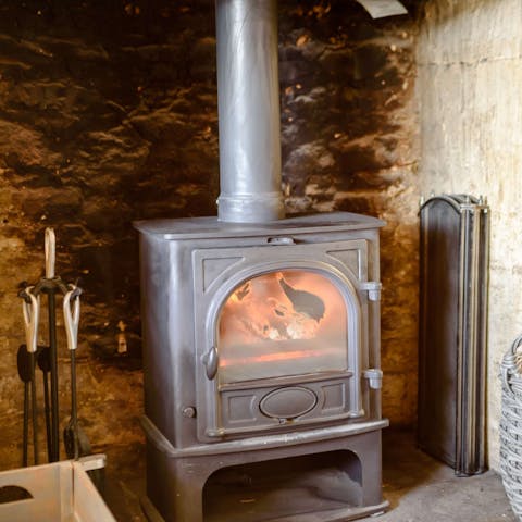 Get cosy beside the wood-burning stove on chilly evenings