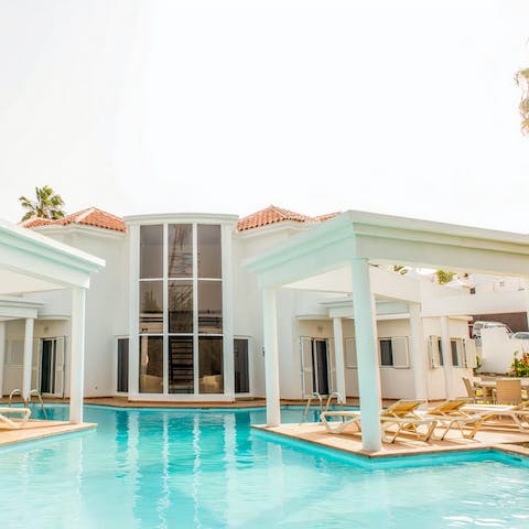 Plunge into the private pool after catching forty winks on a lounger