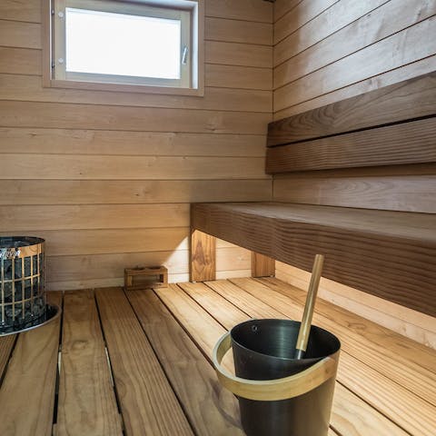 Unwind in the sauna as you sip on a glass of red