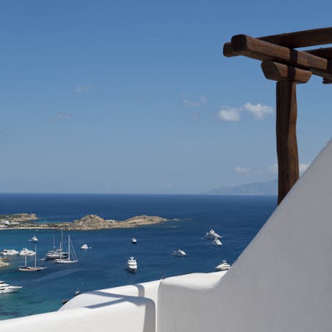 Admire picturesque views over the Aegean Sea from the private balcony