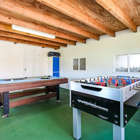 Get competitive with a round of table football in the games room