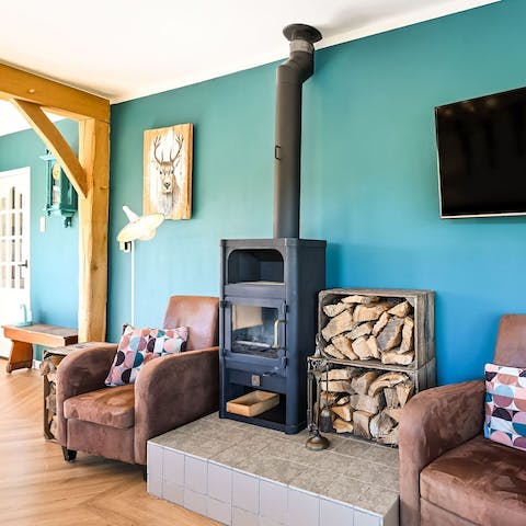 Get cosy next to the wood-burning stove on chilly evenings