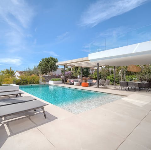 Spend your days lounging by the pool or head to the nearby beaches