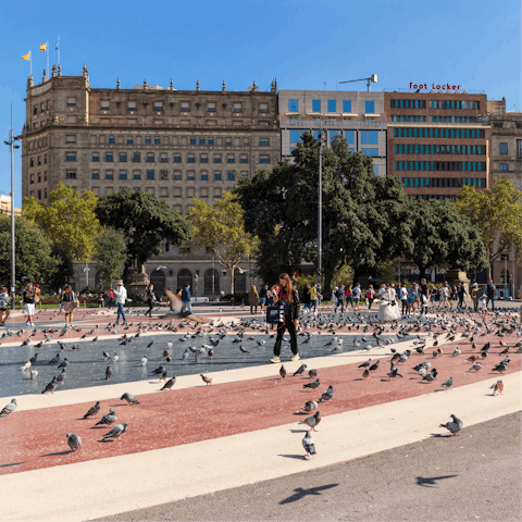 Head to the nearby Plaça de Catalunya, a bustling square with a joyful atmosphere