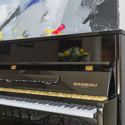 Try your hand at a tune on the upright piano