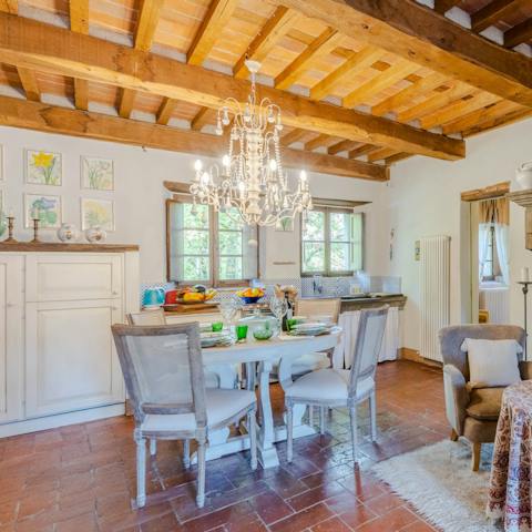 Dine in the rustic dining area, complete with chandelier overhead