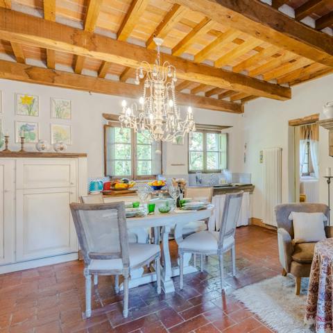 Dine in the rustic dining area, complete with chandelier overhead 