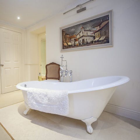Soak in the freestanding slipper bathtub in the master bedroom