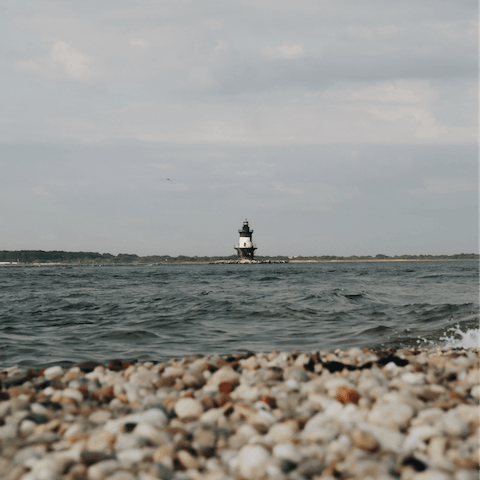 Gaze out at Long Beach Bar Lighthouse from the nearby beach, five minutes away