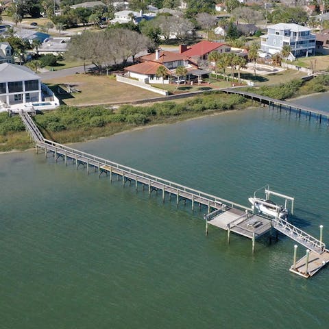 Go fishing, boating or dolphin-spotting on the home's own pier