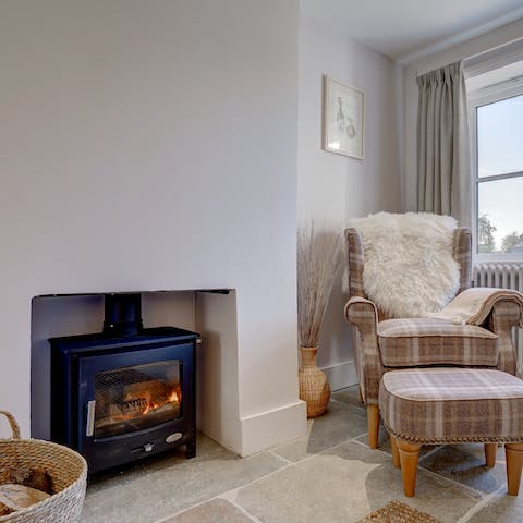 Cosy up with a book next to the log burner after a walk around the village