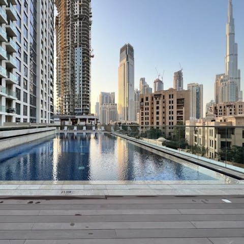 Enjoy a refreshing swim in the building's pool overlooking the Burj Khalifa