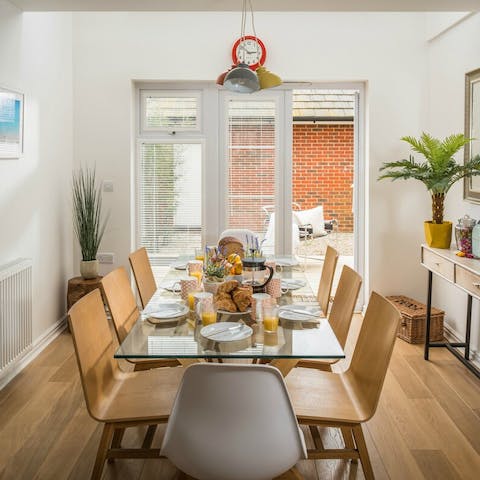 Dine in style at the glass table with room for eight